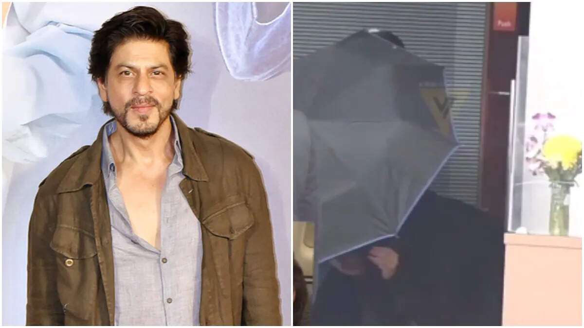 SRK Uses An Umbrella To Hide His Face From The Paps!