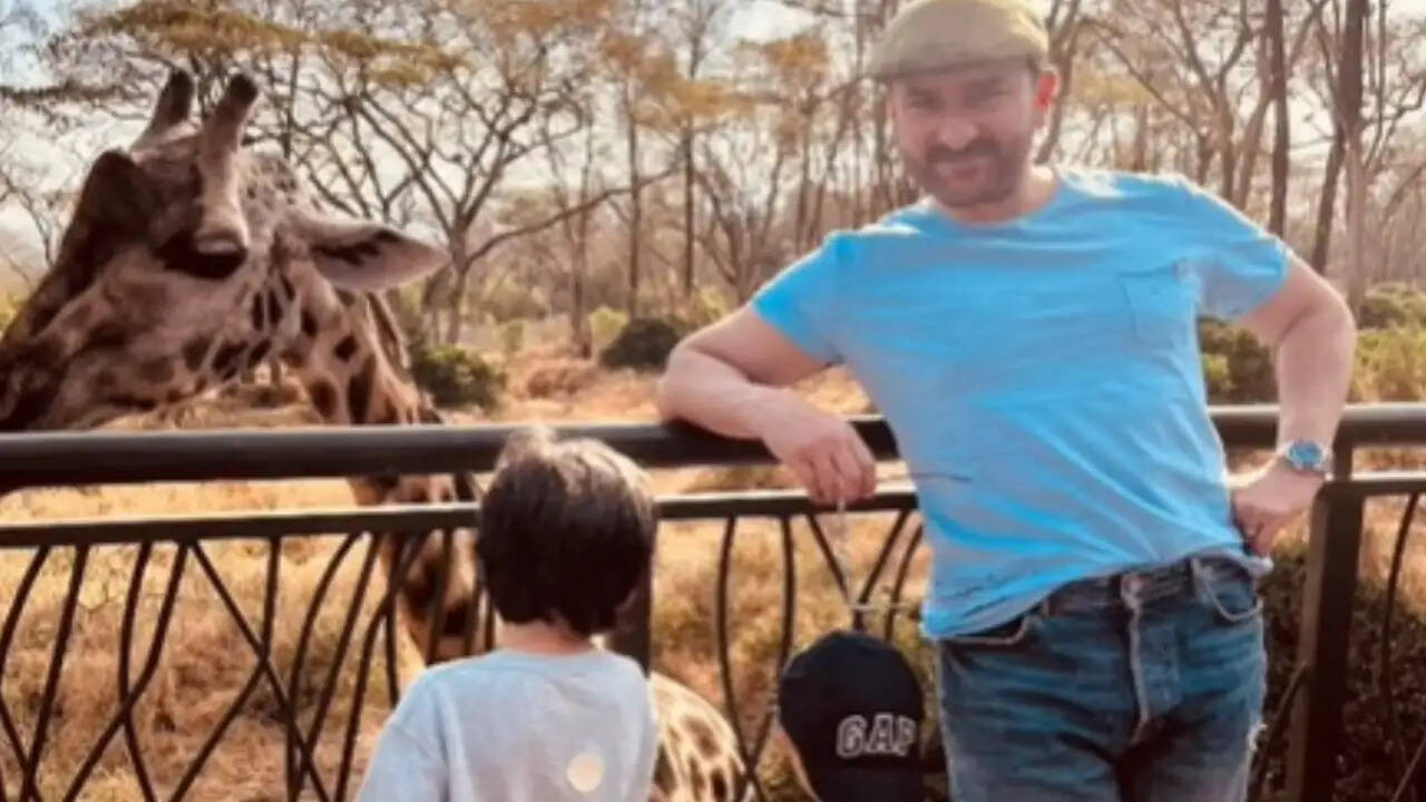 Saif Ali Khan Poses for Kareena Kapoor While Taimur and Jeh Play with a Giraffe